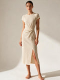 Elettra Ferri asymmetrical maxi dress with button details, flowing fabric, and elegant design for sophisticated evening wear.