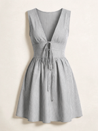 Elettra Ferri lace-up striped cotton dress with a fitted bodice and flared skirt, featuring vertical black and white stripes.