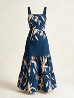 Elettra Ferri printed ruffle A-line midi dress with a fitted bodice and flowy skirt, featuring vibrant floral patterns.