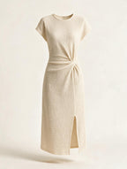 Elettra Ferri asymmetrical maxi dress with button details, flowing fabric, and a stylish, elegant silhouette.