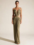 Elettra Ferri halter maxi dress featuring flowy fabric and a fitted bodice, perfect for elegant summer occasions.